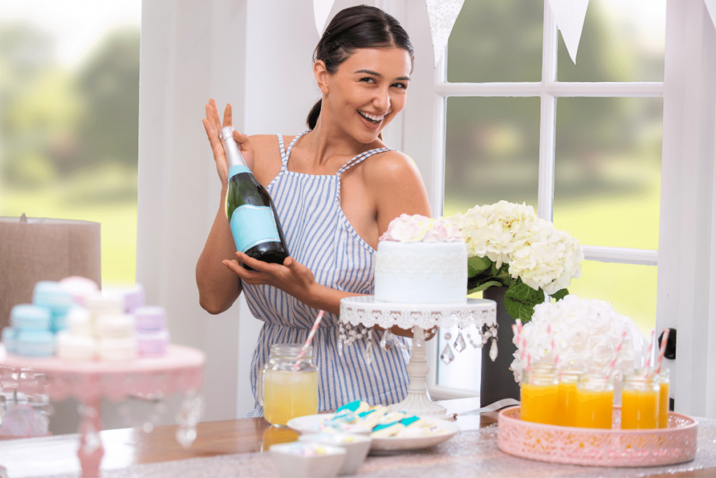 party planner holding a bottle of champagne- best home business ideas for women